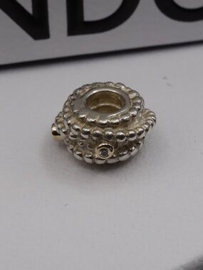 Retired Pandora entangled beauty charm with 14kt gold and diamonds